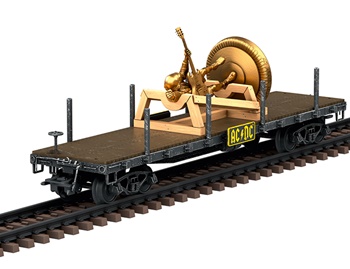 Vagón plano de cuatro ejes tipo americano transportando una estatua.