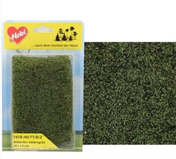 Tapiz de flocado con hojas color verde oscuro.